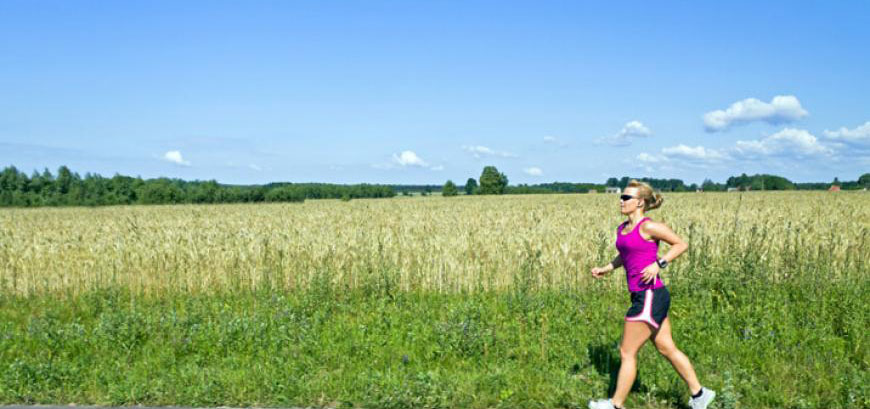 Woman running across a field