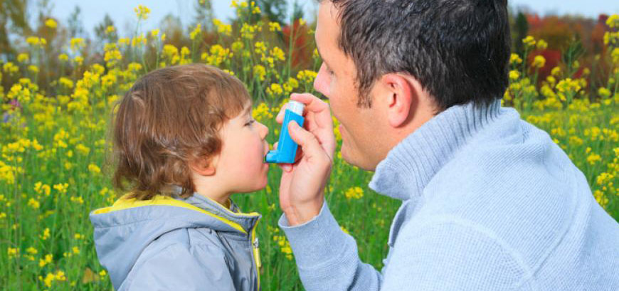 Kid taking inhaler